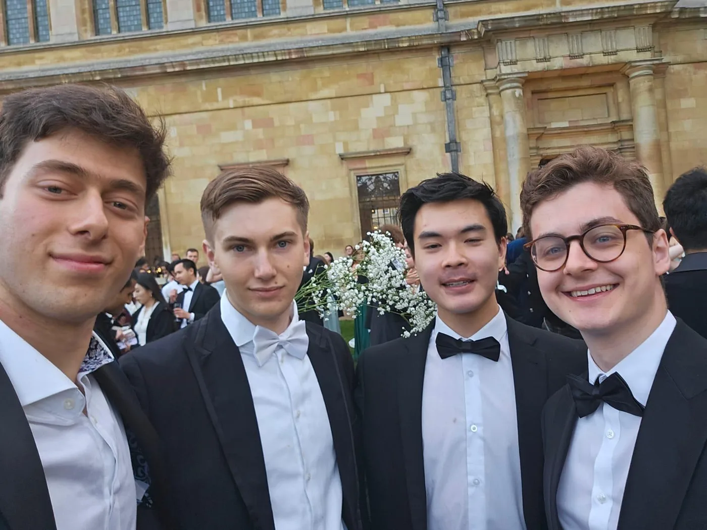 Four people dressed for a formal event