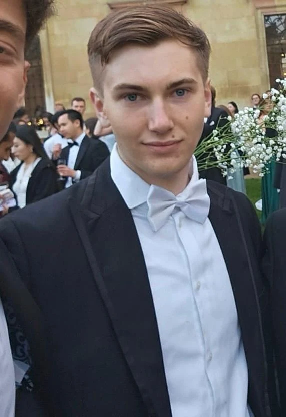 Atticus Kuhn in formal attire